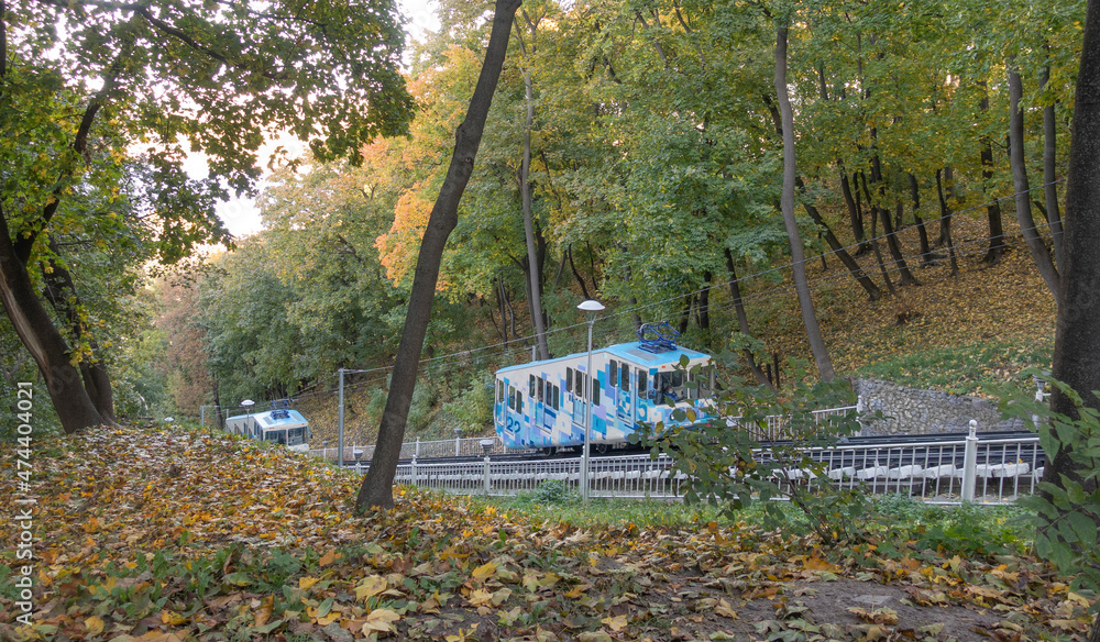 Two cable cars in the autumn park
