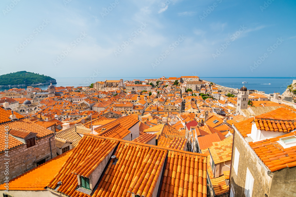 Aerial panoramic view of old city Dubrovnik. Ancient city with big city walls near adriatic sea. View of roofs, sunny summer day.