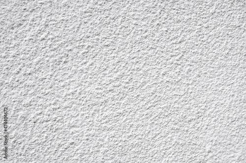 White roller or brush painted wall with texture pattern