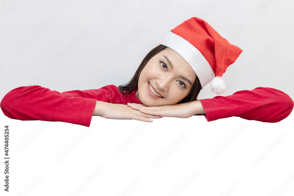 Asian Woman with Santa Claus Hat with Blank Copy Space For Advertisement Asian Woman with Santa Claus Hat with Blank Copy Space For Advertisement