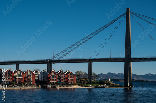 Scenic cityscape of modern norwegian town. Modern architecture of Stavanger. Sunny day. Huge bridge over fjord.