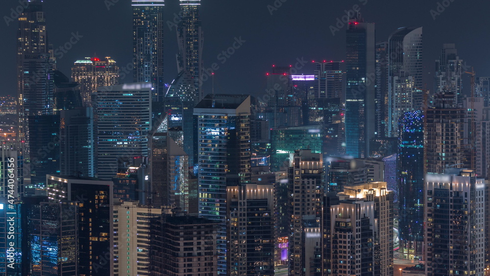 Skyline with modern architecture of Dubai business bay towers night timelapse. Aerial view Skyline with modern architecture of Dubai business bay towers night timelapse. Aerial view