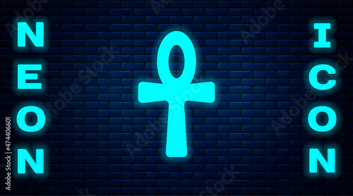 Glowing neon Cross ankh icon isolated on brick wall background. Egyptian word for life or symbol of immortality. Vector