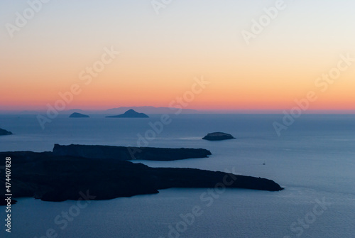 Caldera and Greek islands after sunset