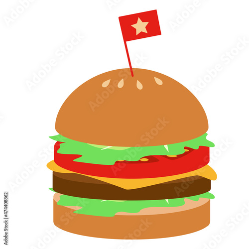 ピックの刺さった肉と野菜のハンバーガー