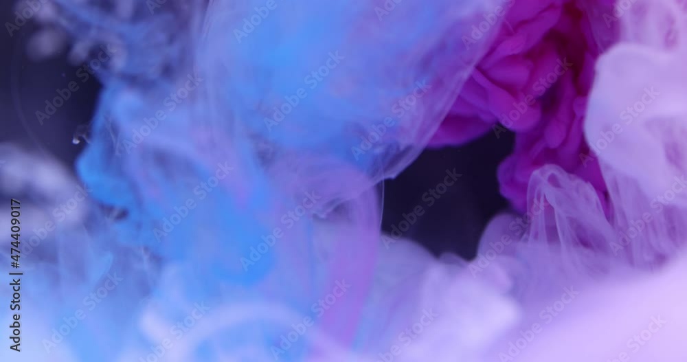 Abstract color ink behind black background Abstract color ink behind black background