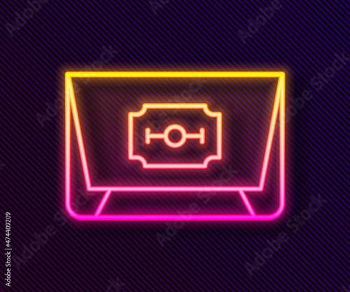 Glowing neon line Blade razor icon isolated on black background. Vector