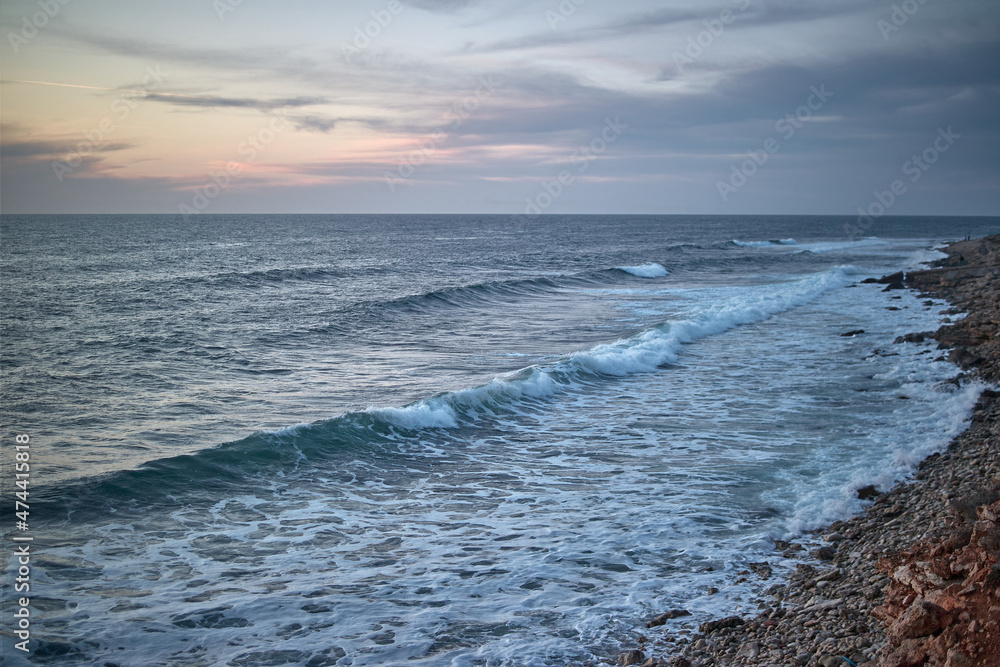 waves at sunset, rocks, beach