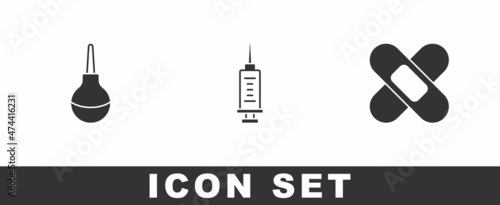 Set Enema, Syringe and Crossed bandage plaster icon. Vector