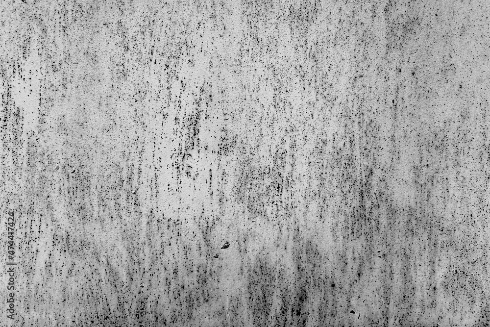 Fototapeta premium Texture of a concrete wall with cracks and scratches which can be used as a background