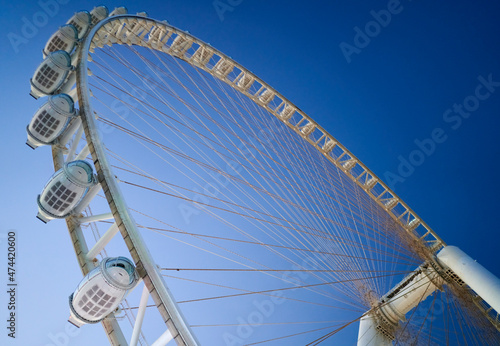 Ferris wheel in Dubai on a background of blue sky