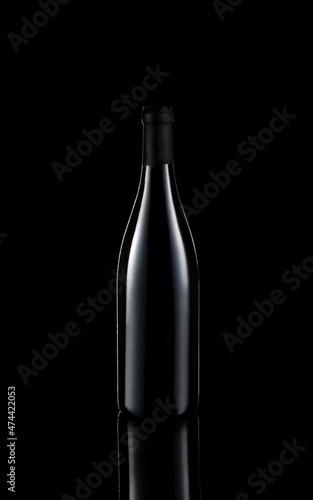 bottle of wine on black background with reflection