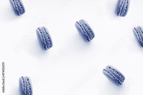 Sweet french desserts of color macaroons or macarons isolated at white background. Color of the year 2022. Main trend concept.