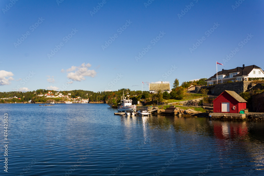 Residential area in Norway with villas and yachts by the sea Residential area in Norway with villas and yachts by the sea