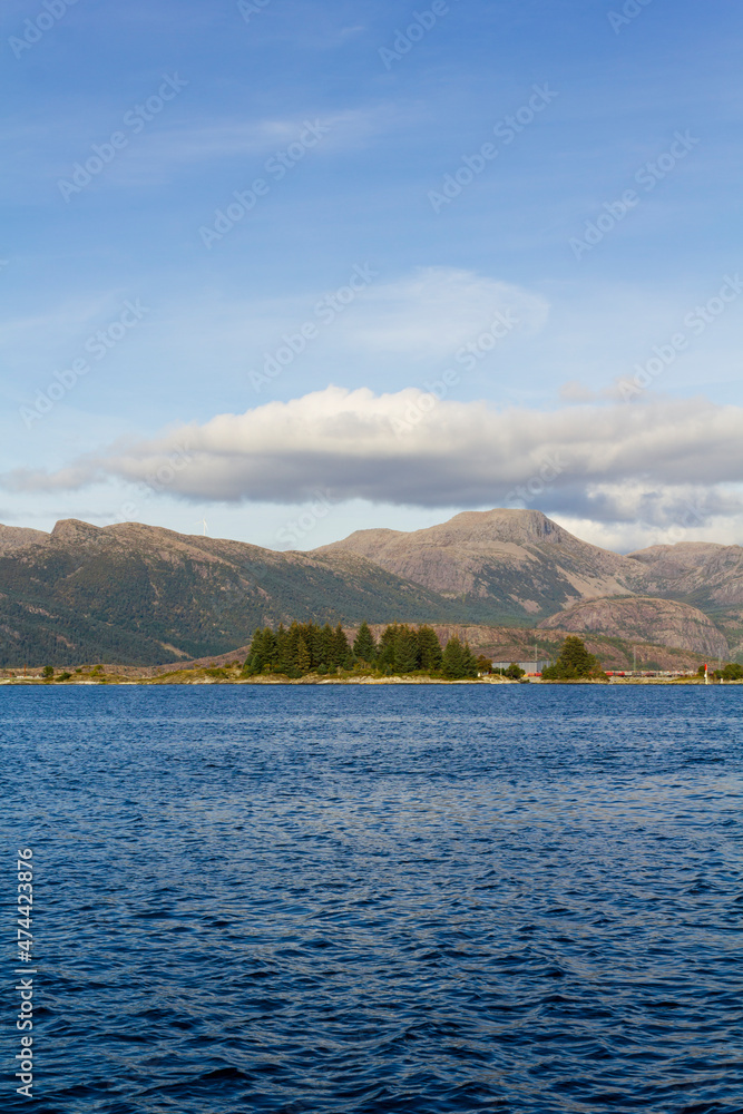 Calm sea with mountains on the background