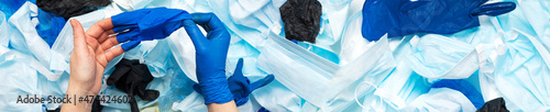 Fotografie Waste of used personal protective equipment PPE gloves, disposable masks, shoe covers of medical workers in the form of a background