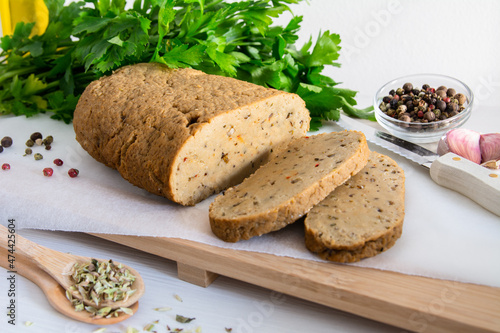 seitan or vegan meat sliced with spices such as oregano, pepper, garlic, and parsley. photo