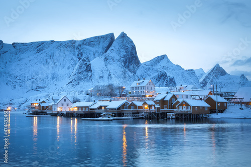View on the house in the Sarkisoy village, Lofoten Islands, Norway. Landscape in winter time during blue hour. Mountains and water. Travel - image © biletskiyevgeniy.com