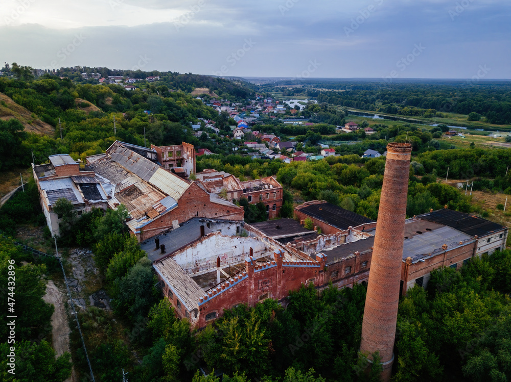 Ruined overgrown abandoned sugar factory in Ramon, aerial view