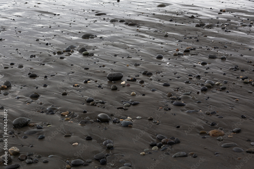 Smooth Pebbles on Wet Beach Smooth Pebbles on Wet Beach