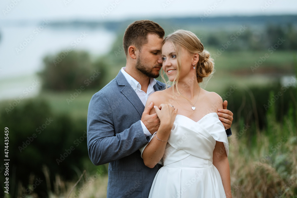 bride and groom on in the woods