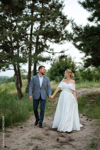 bride and groom on in the woods © omelnickiy