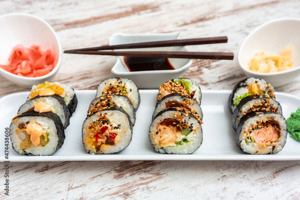 Sushi set with soy sauce and pickled ginger Sushi set with soy sauce and pickled ginger