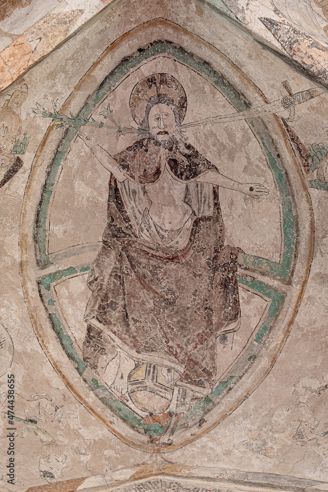 Gothic painting of Christ sitting on the rainbow, resting his feet on the orb
