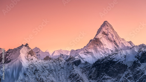 Panoramic view to summit Ama Dablam and snow peaks with beautiful light after sunset in Nepal