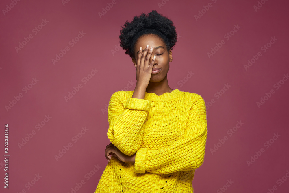 Upset african american young girl with facepalm gesture, blaming herself, feeling sorrow because of bad memory Upset african american young girl with facepalm gesture, blaming herself, feeling sorrow because of bad memory