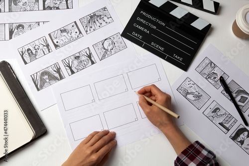 The artist draws a storyboard for the film. The director creates the storytelling by sketching footage of the script on paper. photo