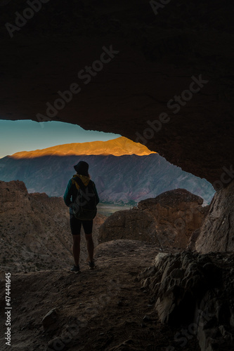 girl in a cave in the mountains