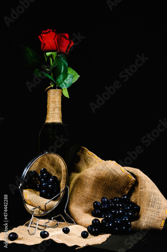 still life with grapes, with a mirror, costal or yute, roses, and mirror, vertical photo photo