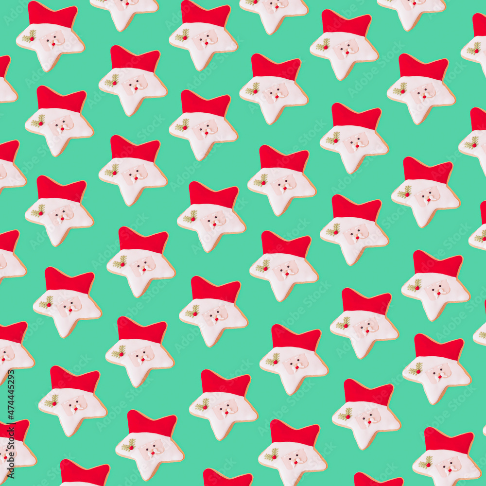The pattern of Santa Claus cookies in green background The pattern of Santa Claus cookies in green background