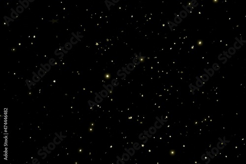 Shiny golden glitter stars scattered in space on black background