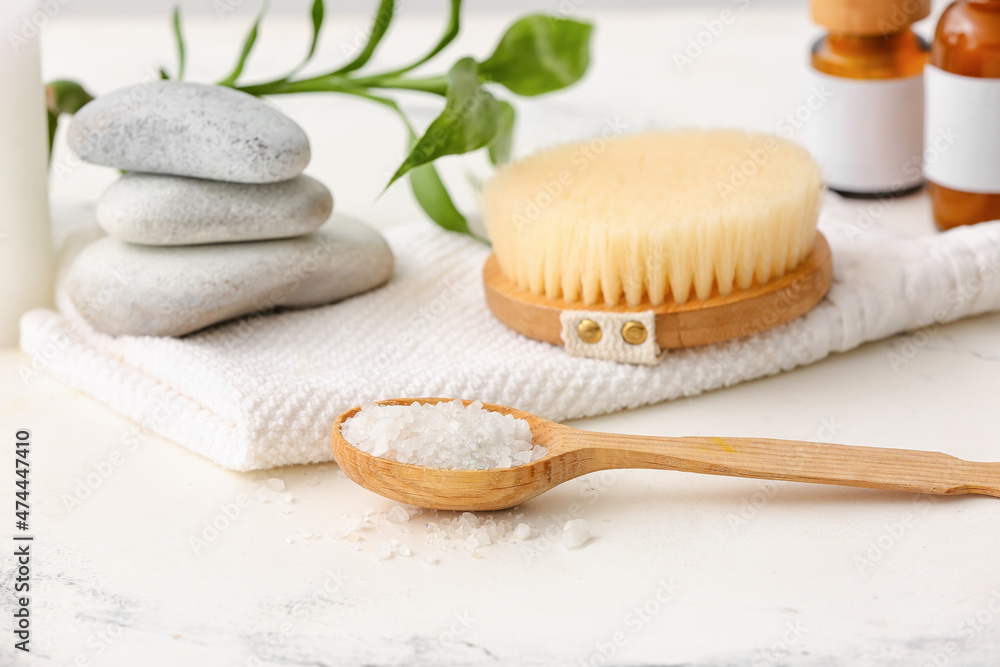 Spa set with spoon of salt on light background Spa set with spoon of salt on light background