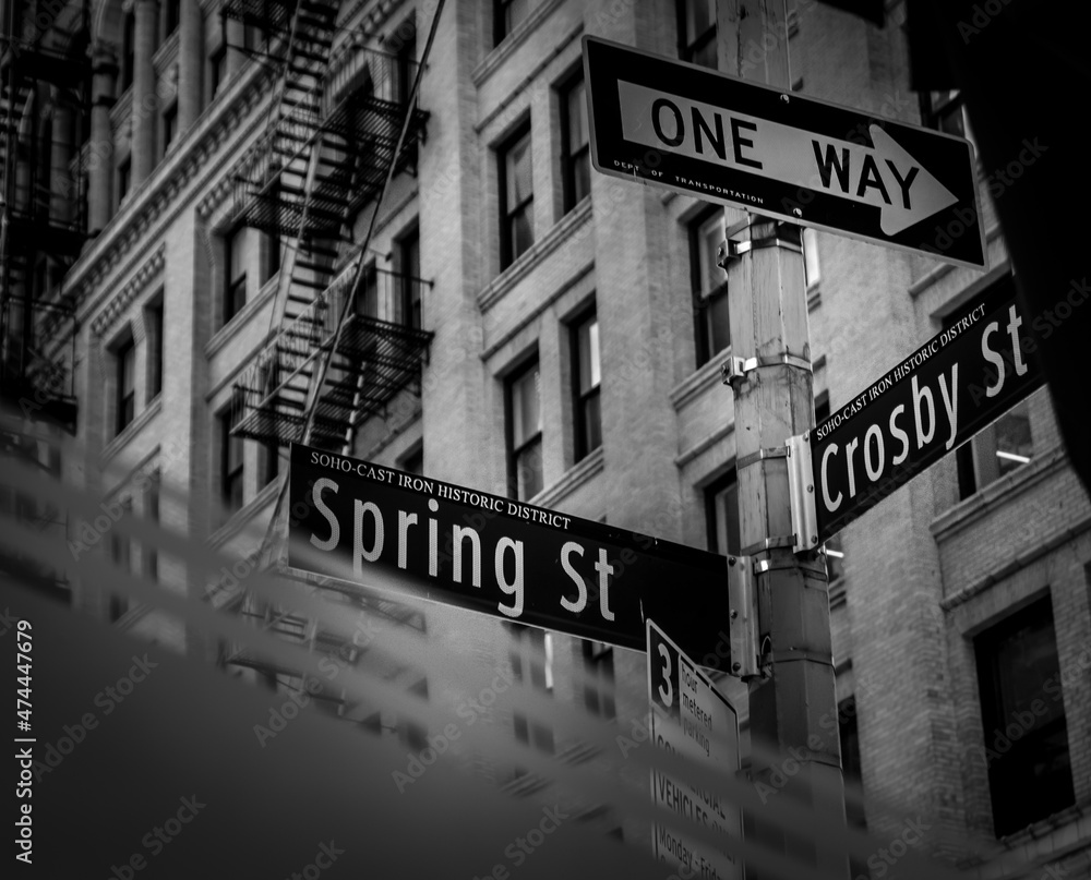 Fototapeta premium Black and white street signs of Spring St, Crosby St. and One Way in SoHo New York City