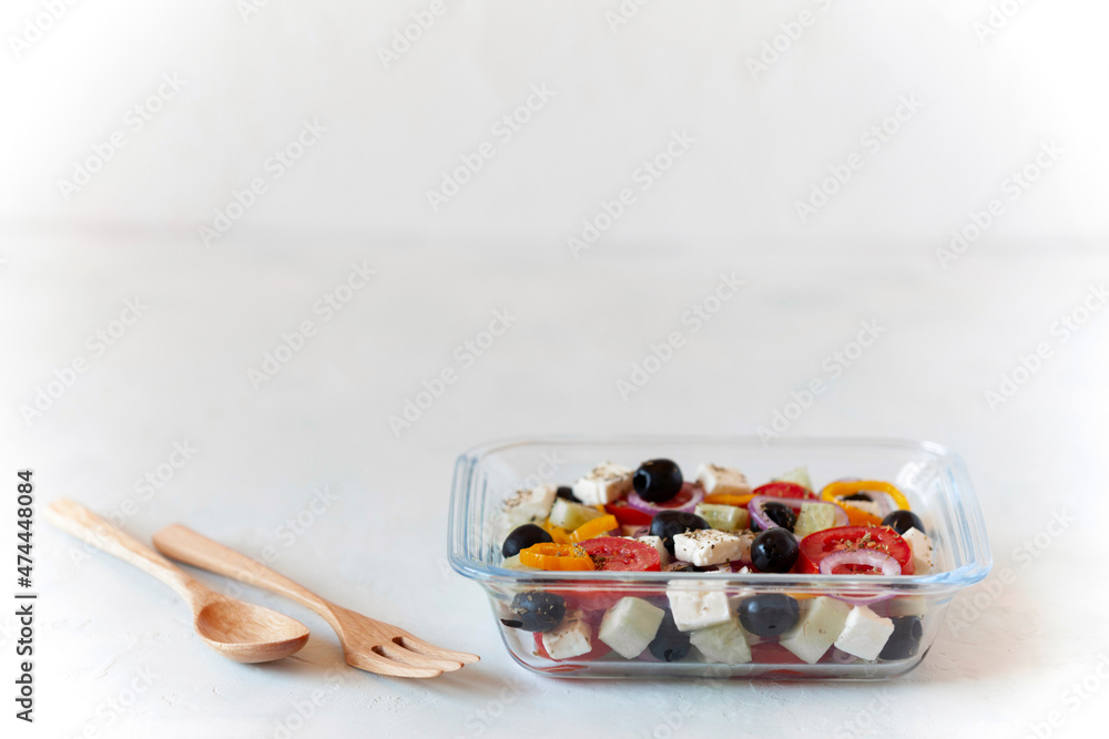 Greek salad in a glass container, concept of eating at work Greek salad in a glass container, concept of eating at work