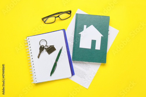 Paper house with key, eyegl...