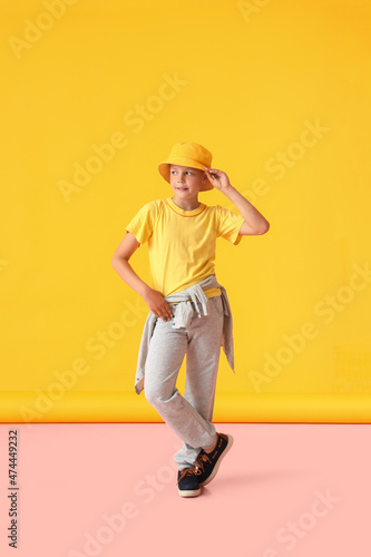 Cool little boy on color background