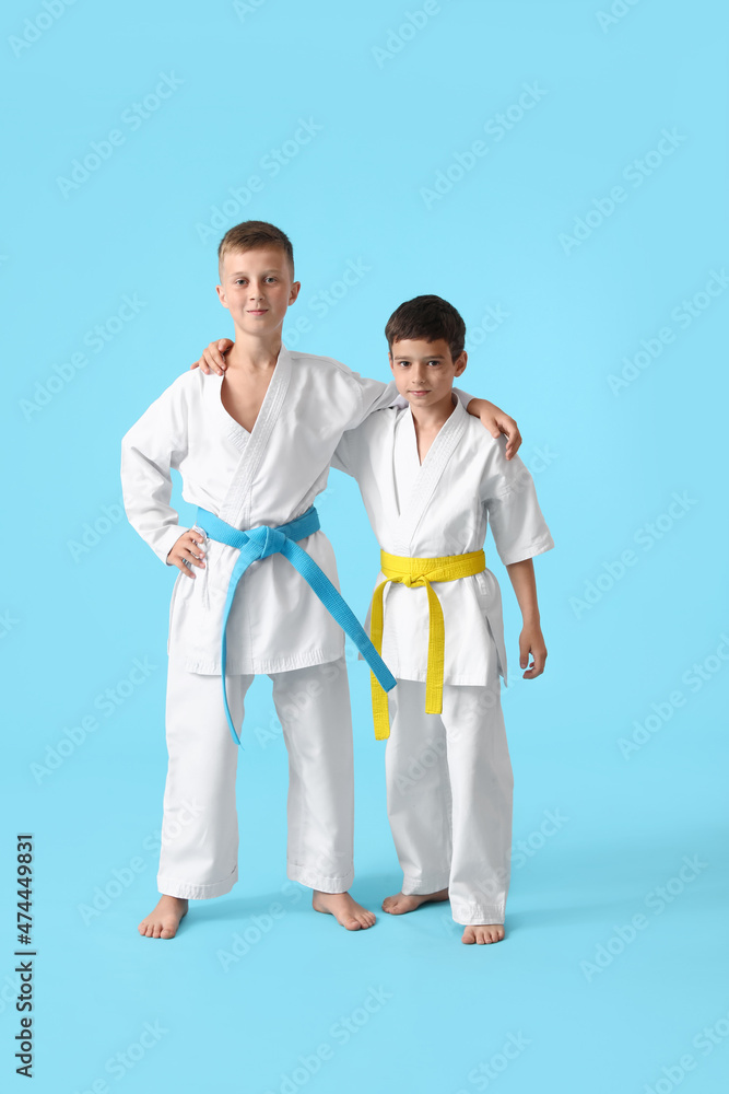 Little boys in karategi on color background Little boys in karategi on color background