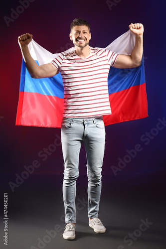 Happy man with flag of Russ...