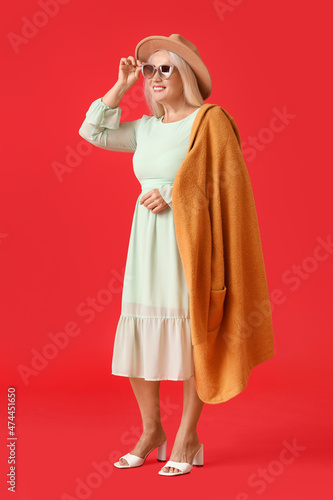 Fashionable mature woman in...