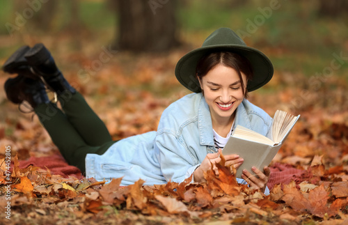 Smiling woman lying on plai...
