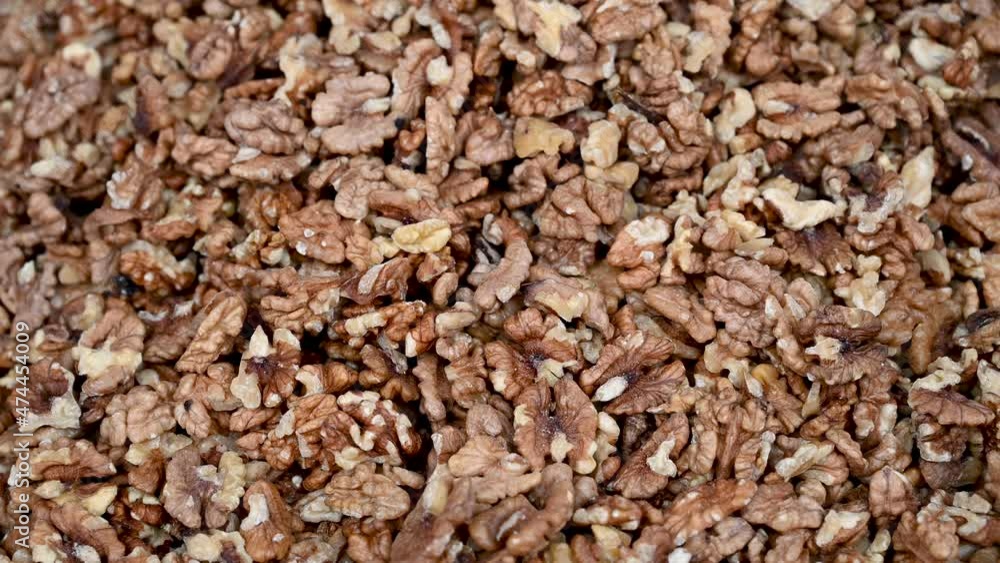 Walnuts for sale in market. Close up of walnuts in shells. Bazaar. Dried walnuts closeup. Walnuts for sale in market. Close up of walnuts in shells. Bazaar. Dried walnuts closeup.