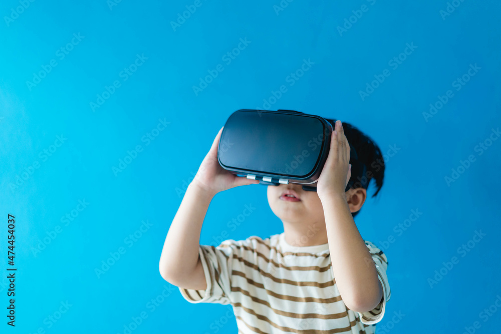 kid child toddler boy playing game on virtual reality vr glasses.future digital technology. kid toddler boy play VR virtual.future technology.Online learning education student with innovation tech. kid child toddler boy playing game on virtual reality vr glasses.future digital technology. kid toddler boy play VR virtual.future technology.Online learning education student with innovation tech.