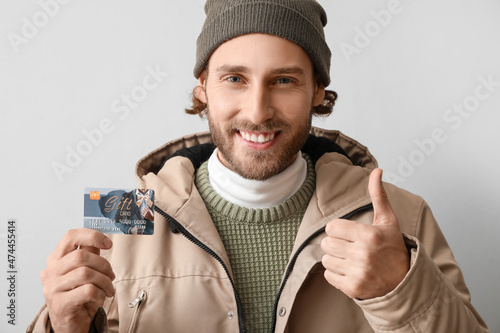 Young man with gift card sh...