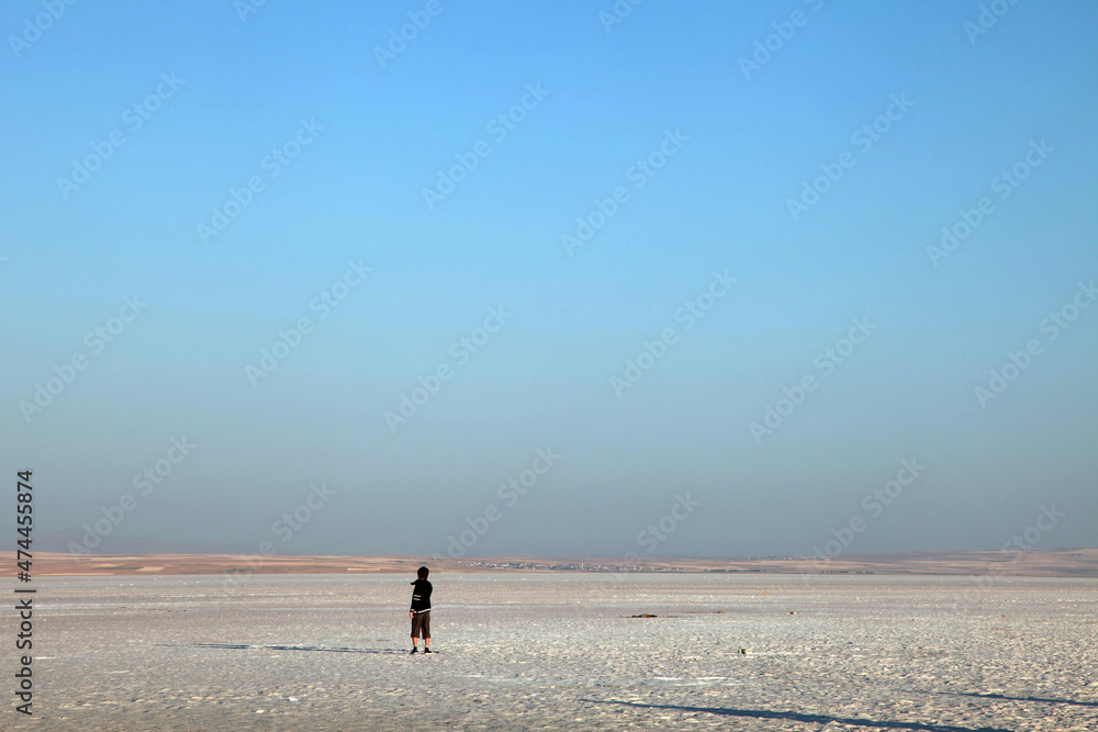 People walking at Salt Lake in Aksaray, Turkey. Salt Lake is the second largest lake in Turkey with its 1665 km2.