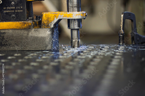 Drilling holes in steel factory