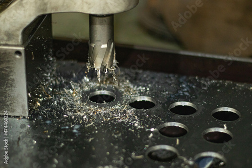 A thin steel plate was punched into a hole.